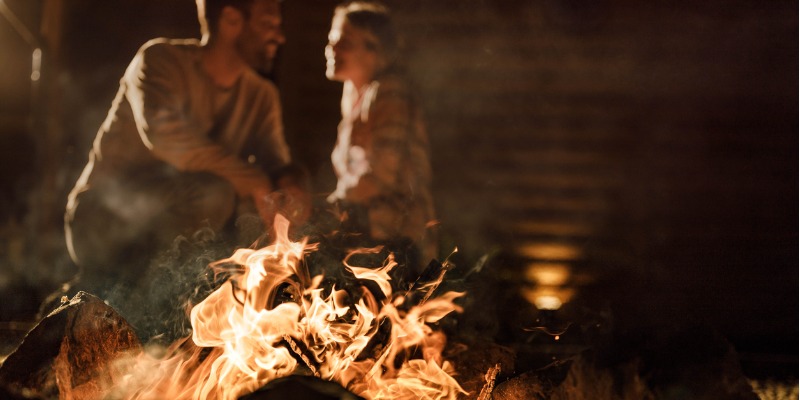 couple sitting by the fire
