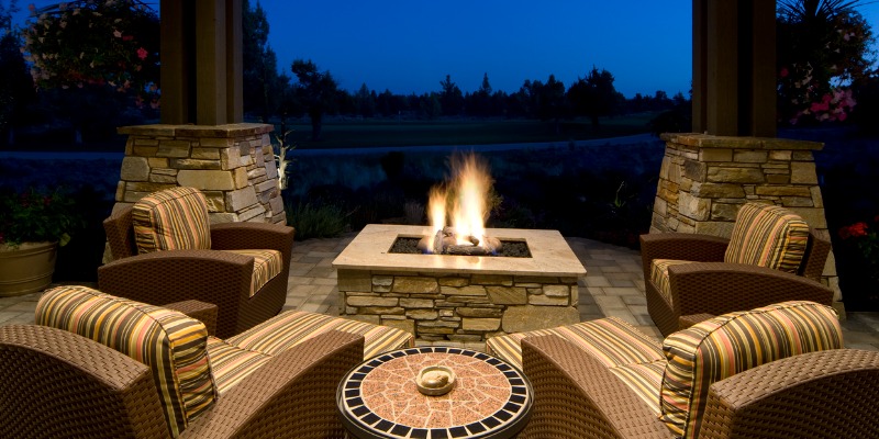 outdoor firepit with lit firepit
